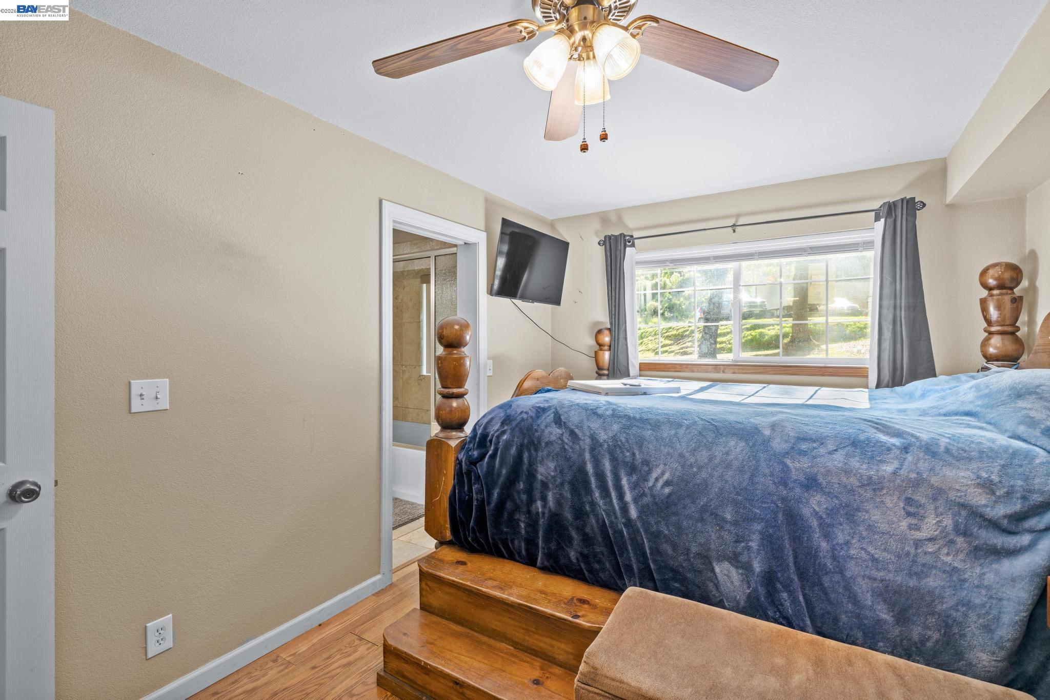 7777 Del Valle Road Livermore, CA 94550 - Photo 30 of 60 a bedroom with a bed and a large window