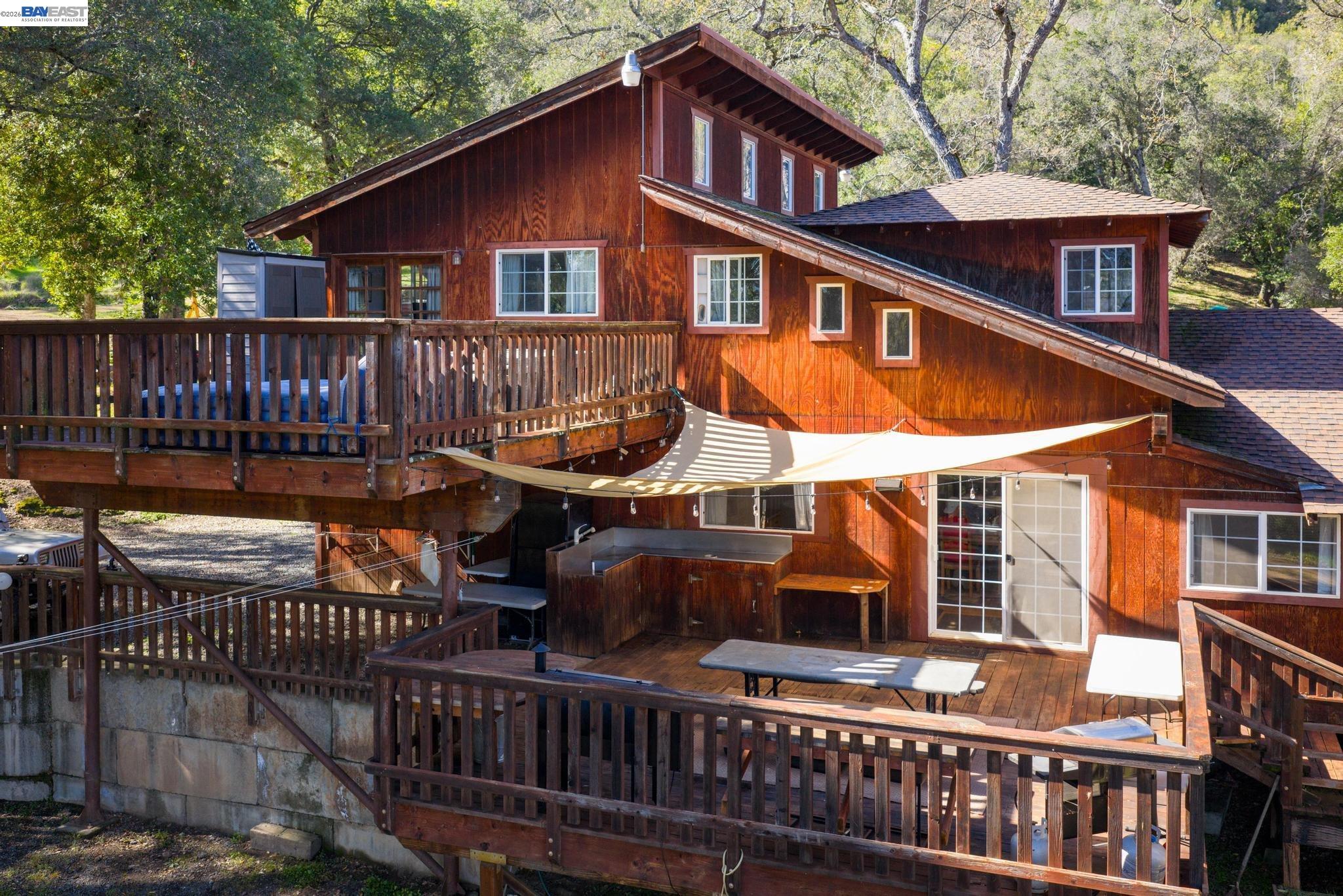 7777 Del Valle Road Livermore, CA 94550 - Photo 43 of 60 a view of a house with wooden deck and furniture