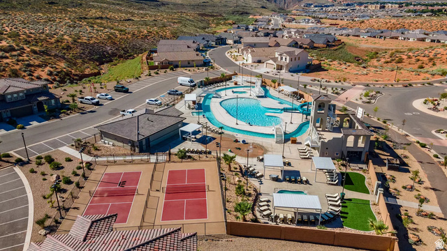 1166 North Riviera Alley Washington, UT 84780 - Photo 2 of 26 Aerial perspective of suburban area featuring a pool