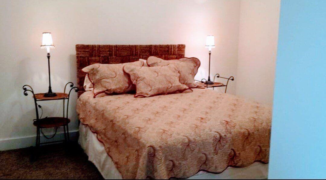 102 East Market Street Mount Carroll, IL 61053 - Photo 20 of 48 a bed sitting in a bedroom next to a lamp