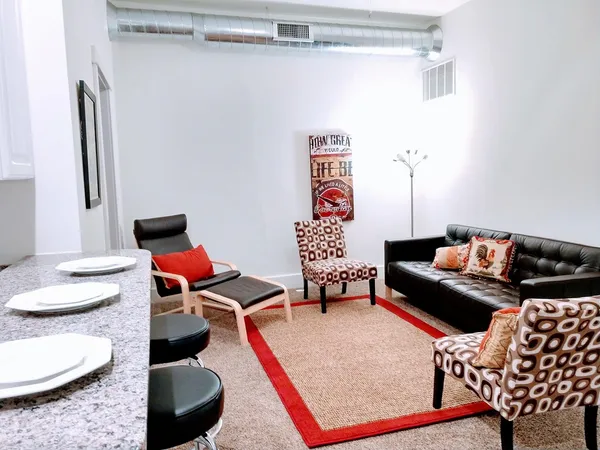 a living room with furniture and a window