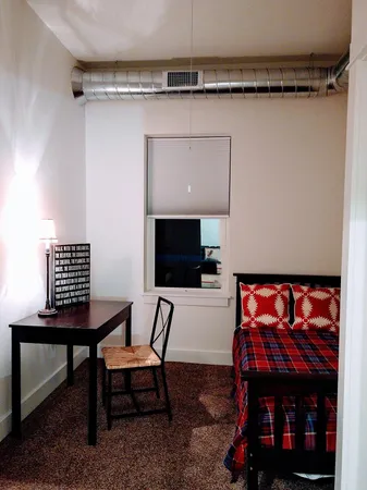 a view of a livingroom with furniture and a flat screen tv