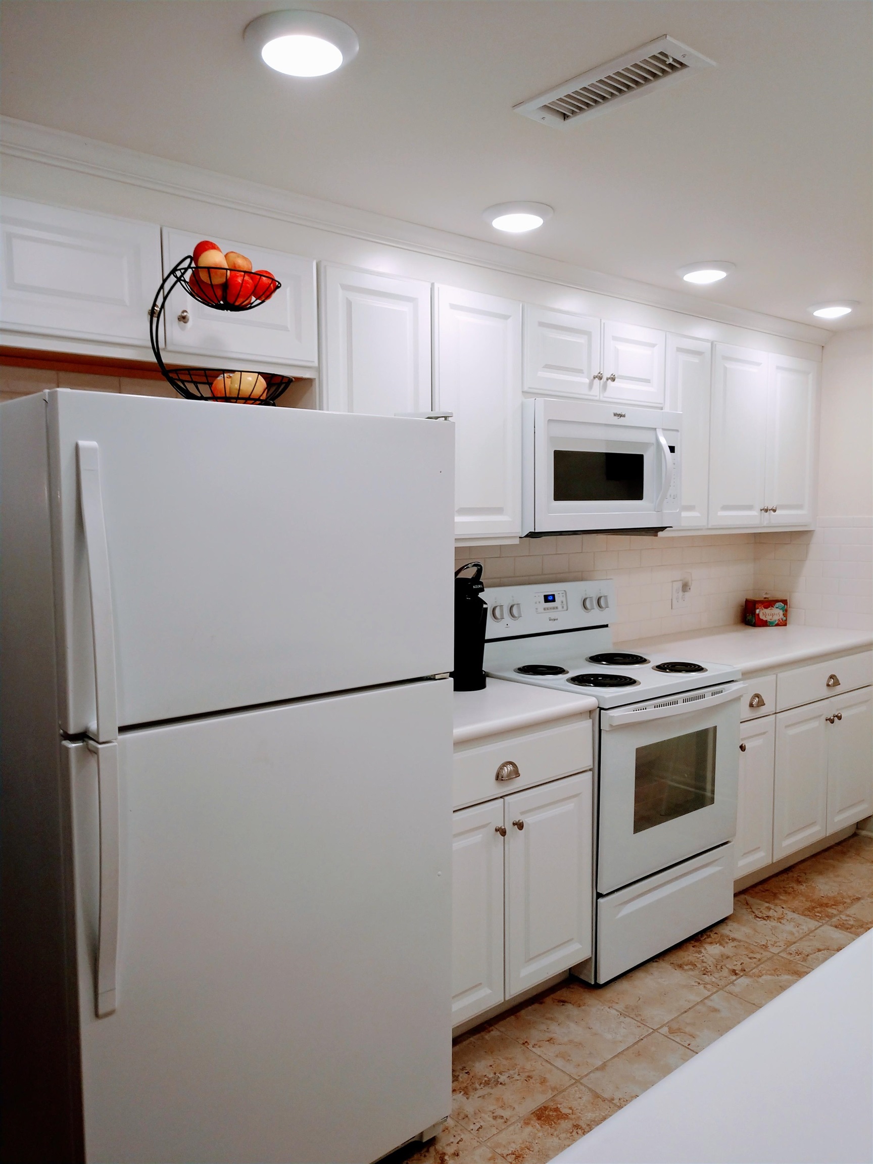 102 East Market Street Mount Carroll, IL 61053 - Photo 41 of 48 a kitchen with stainless steel appliances white cabinets and a refrigerator