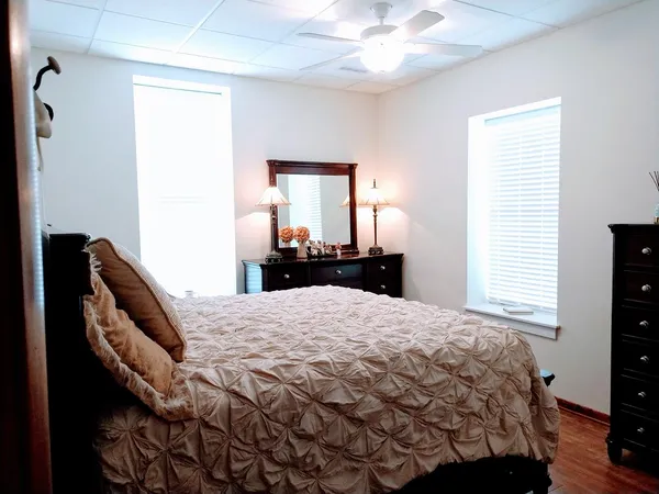 a bedroom with a bed and a window