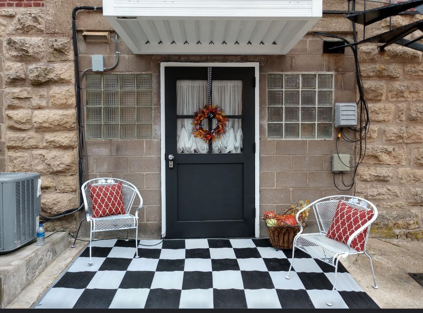 102 East Market Street Mount Carroll, IL 61053 - Photo 46 of 48 a black and white checkered floor with a rug