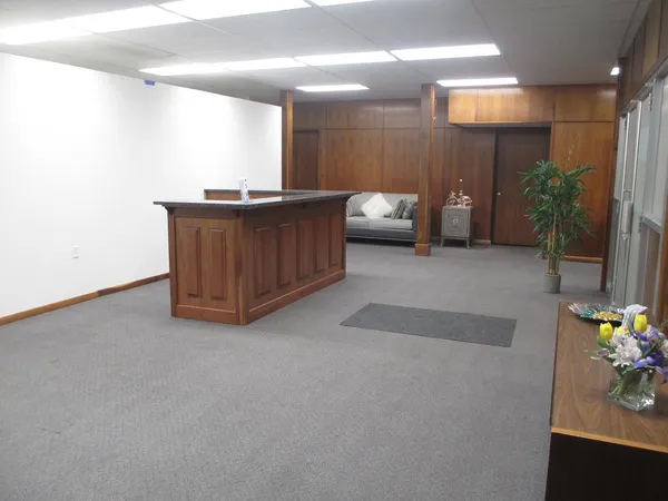 a view of a hallway with seating area