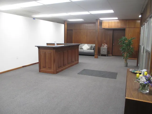 a view of a hallway with seating area