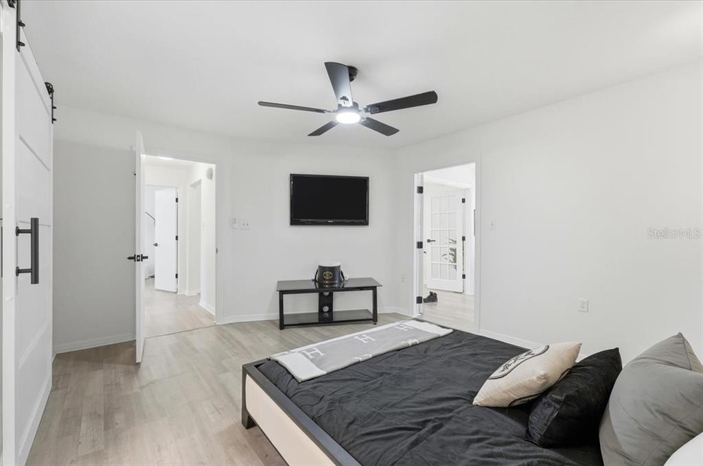 669 Eagle Run Lakeland, FL 33809 - Photo 15 of 69 a bedroom with a bed and a flat screen tv