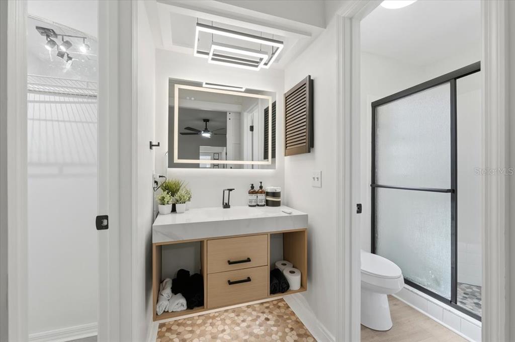 669 Eagle Run Lakeland, FL 33809 - Photo 16 of 69 a bathroom with a sink toilet and shower