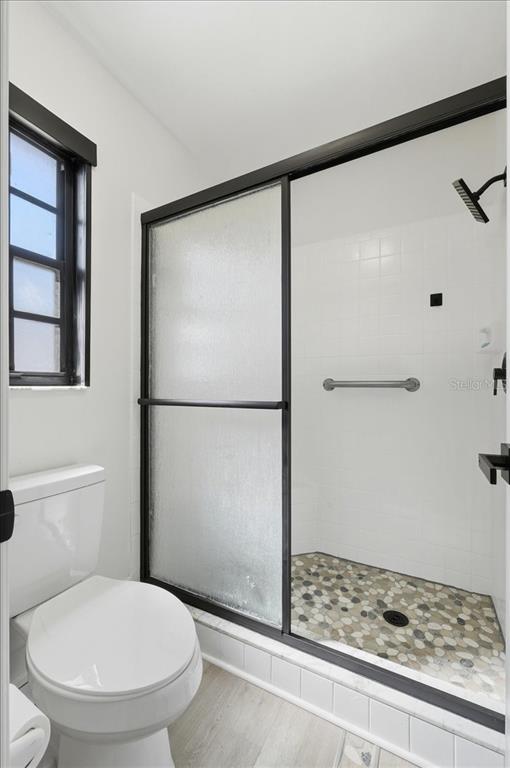 669 Eagle Run Lakeland, FL 33809 - Photo 17 of 69 a bathroom with a toilet and a shower
