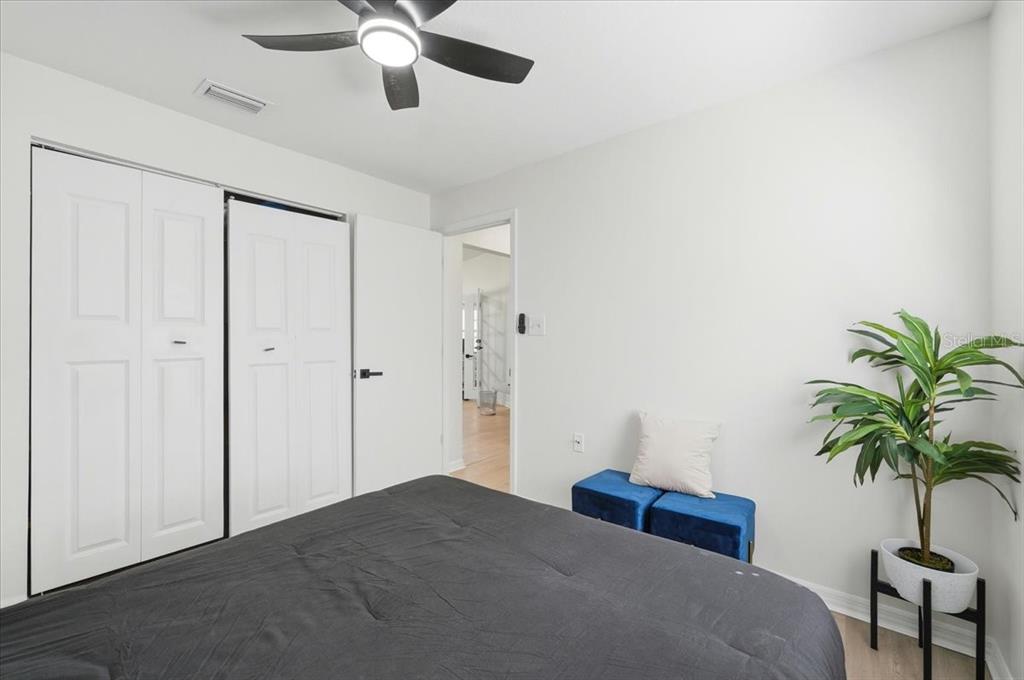 669 Eagle Run Lakeland, FL 33809 - Photo 19 of 69 a bedroom with a bed and a potted plant