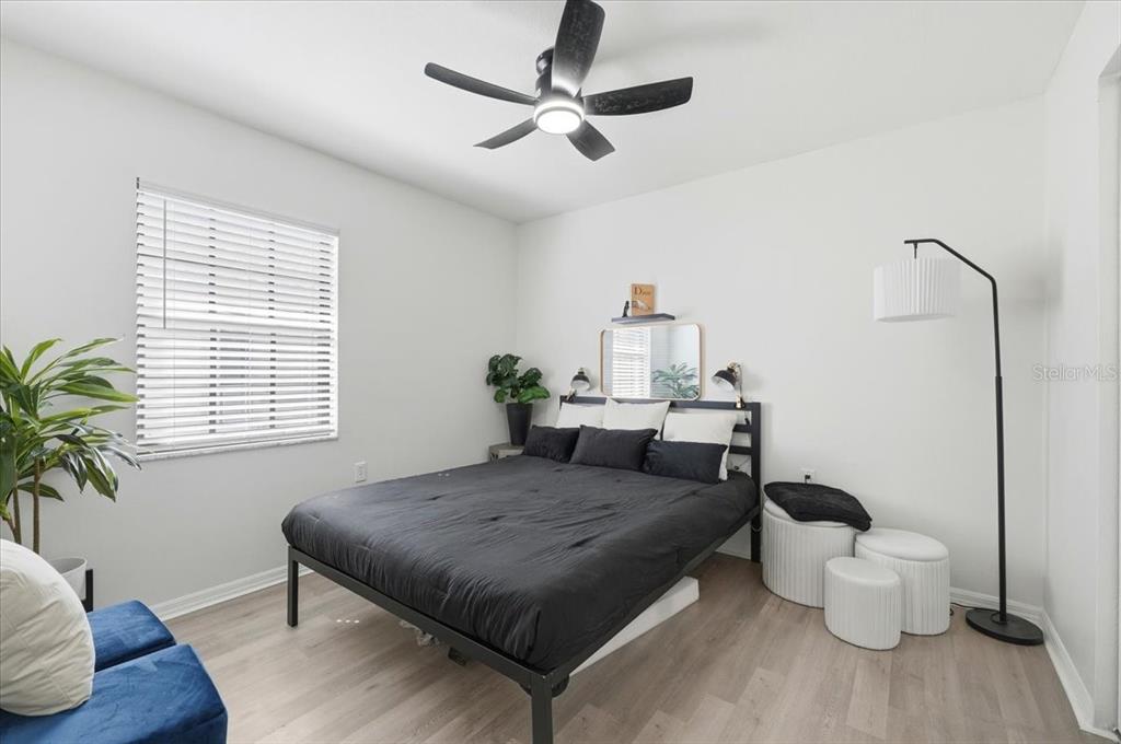 669 Eagle Run Lakeland, FL 33809 - Photo 20 of 69 a bedroom with a bed and wooden floor