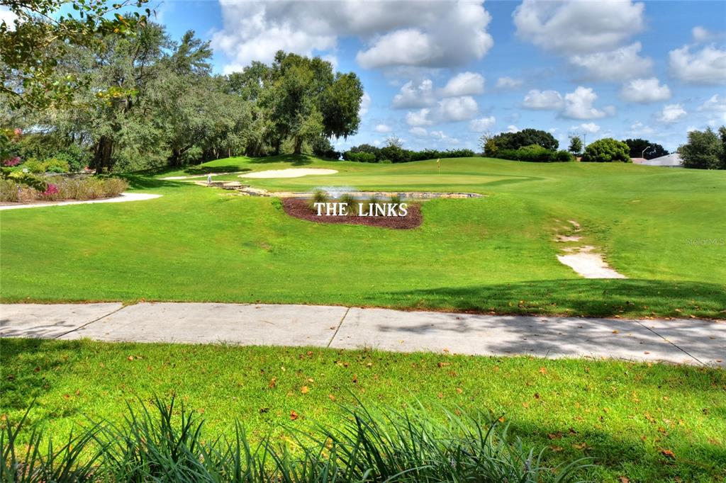 669 Eagle Run Lakeland, FL 33809 - Photo 34 of 69 a view of a golf course with a lake