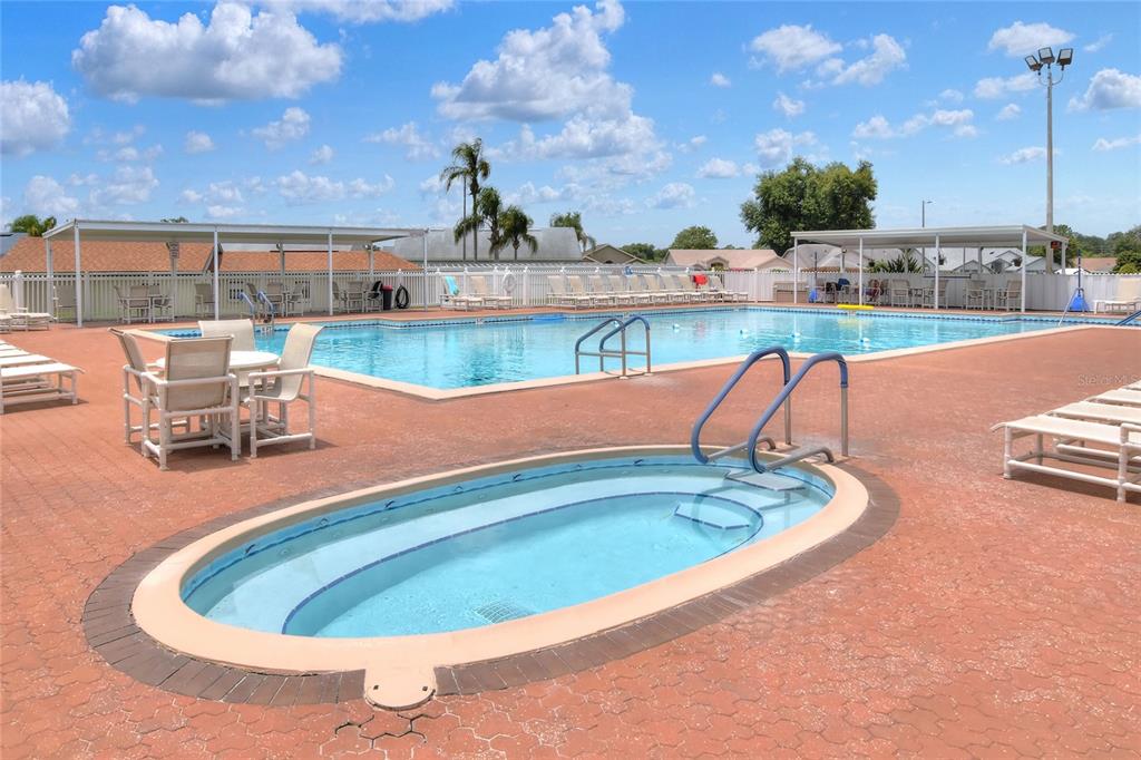 669 Eagle Run Lakeland, FL 33809 - Photo 37 of 69 a view of a swimming pool with lawn chairs