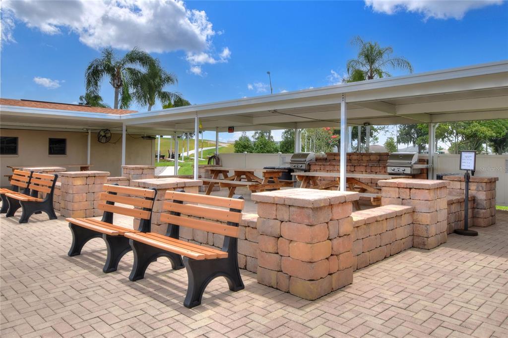 669 Eagle Run Lakeland, FL 33809 - Photo 66 of 69 a living room with patio furniture and a potted plants