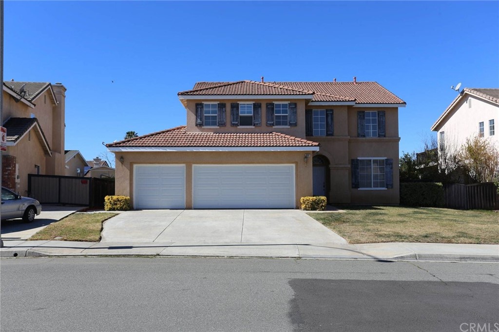 8961 Tree Farm Lane Riverside, CA 92508 - Photo 1 of 1 a front view of a house with yard