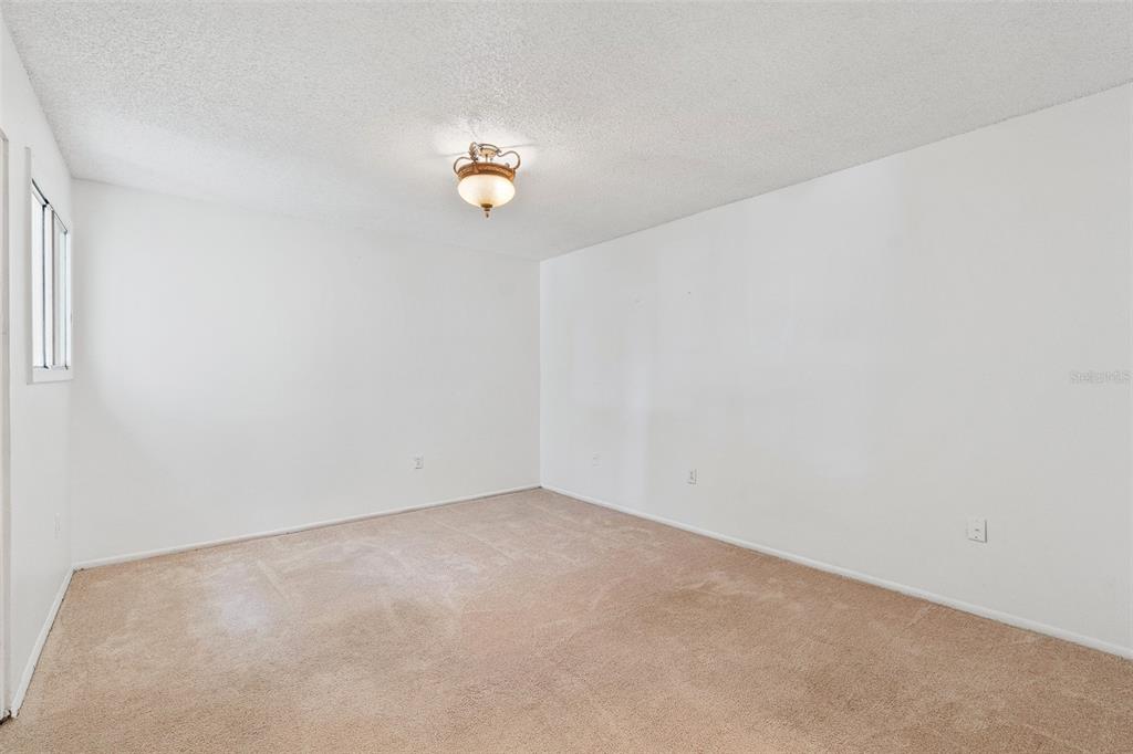 916 Lake Destiny Road, Unit E Altamonte Springs, FL 32714 - Photo 12 of 26 an empty room with a window