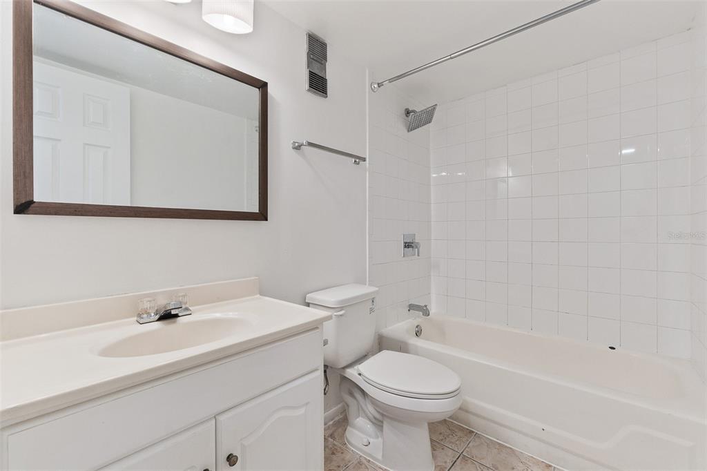 916 Lake Destiny Road, Unit E Altamonte Springs, FL 32714 - Photo 19 of 26 a bathroom with a sink a toilet and shower