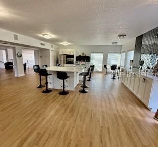 916 Lake Destiny Road, Unit E Altamonte Springs, FL 32714 - Photo 23 of 26 a living room with furniture and a wooden floor