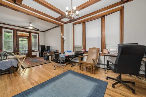a very nice looking living room with furniture and floor to ceiling windows