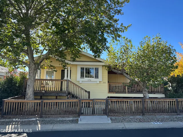 a view of a deck with a fence and a swing