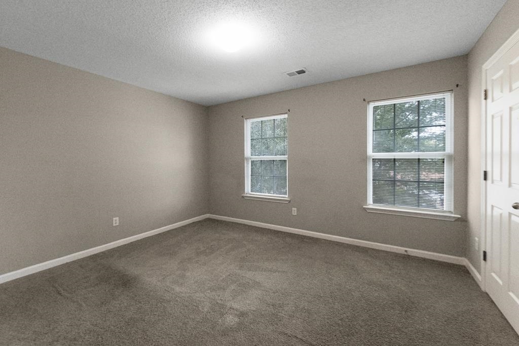 885 Ruby Creek Cove Memphis, TN 38109 - Photo 14 of 25 an empty room with windows