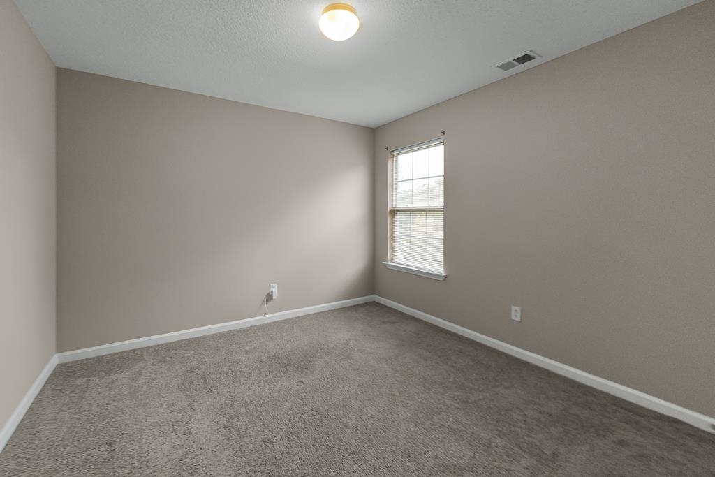885 Ruby Creek Cove Memphis, TN 38109 - Photo 17 of 25 a view of an empty room with a window