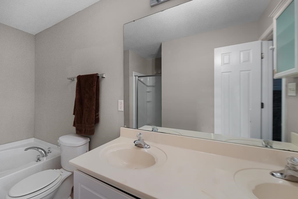885 Ruby Creek Cove Memphis, TN 38109 - Photo 20 of 25 a bathroom with a sink vanity and toilet