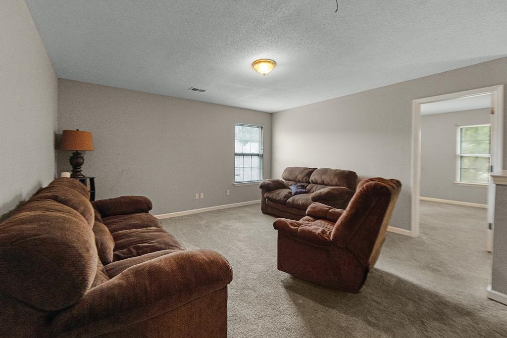 885 Ruby Creek Cove Memphis, TN 38109 - Photo 6 of 25 a living room with furniture and a window