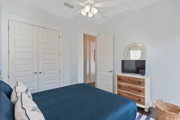 a bedroom with a bed and a television