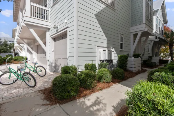 a couple of bicycles parked next to a white building