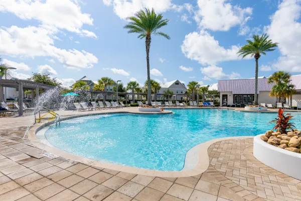 a view of a swimming pool and a yard