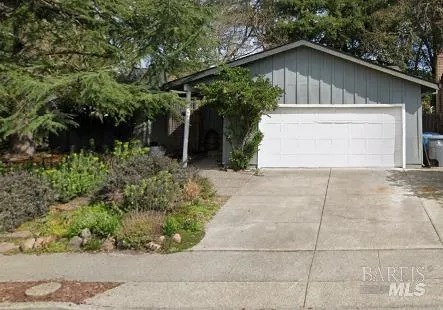 a small white house with a outdoor space