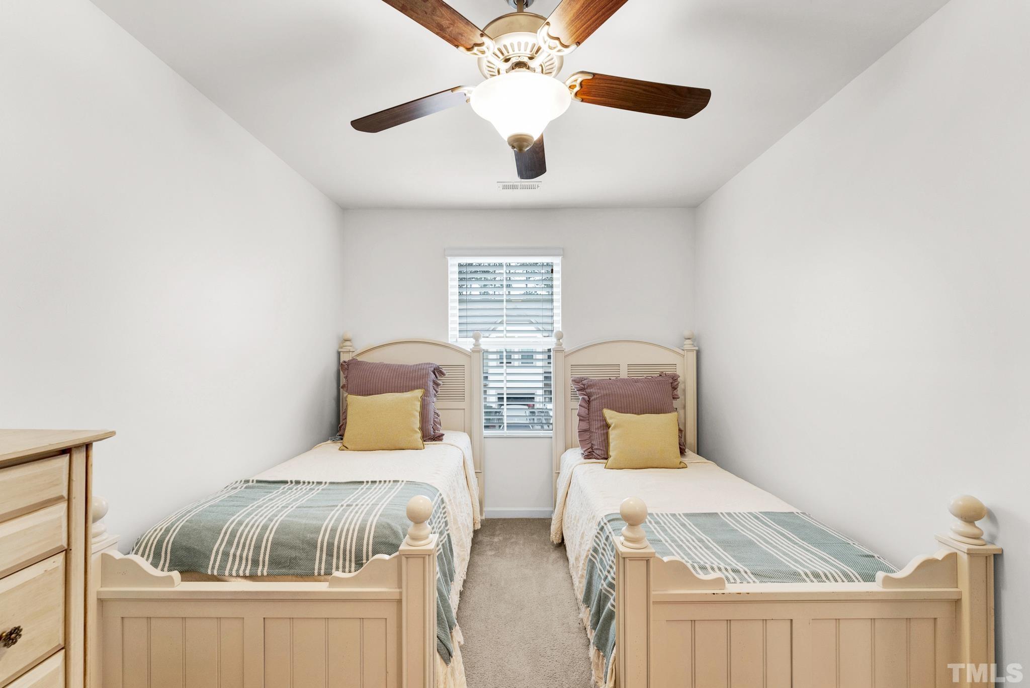 1004 Grand Ridge Drive Rolesville, NC 27571 - Photo 11 of 24 a bedroom with double bed and a window