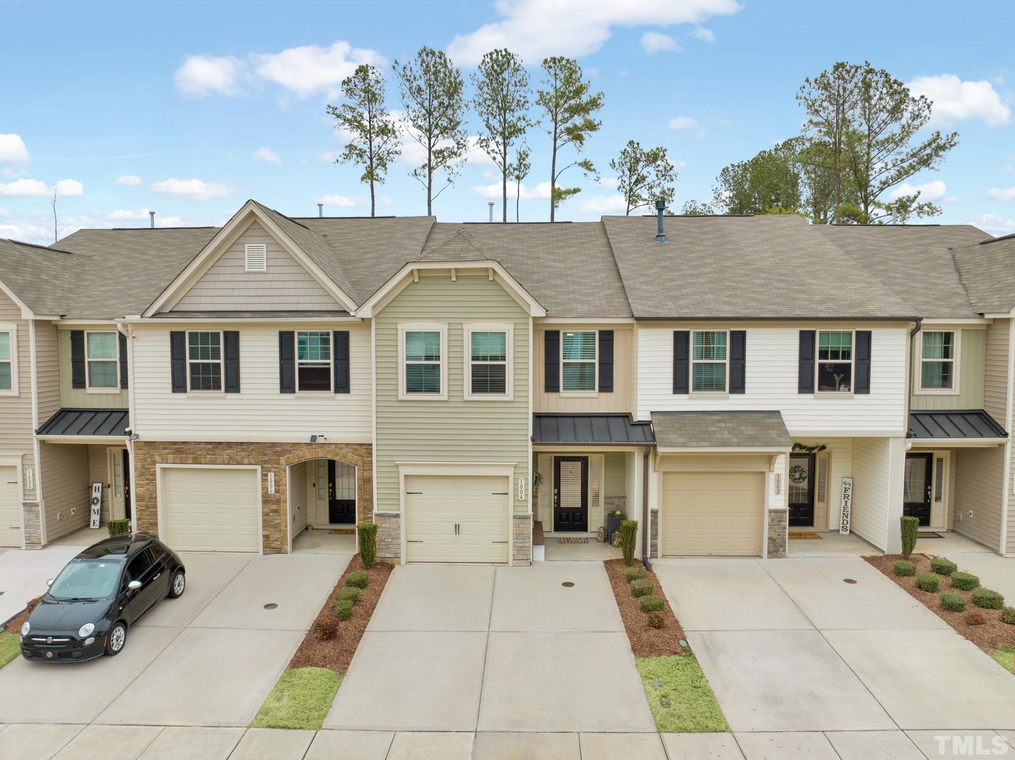 1004 Grand Ridge Drive Rolesville, NC 27571 - Photo 19 of 24 a view of residential houses with yard and parking space