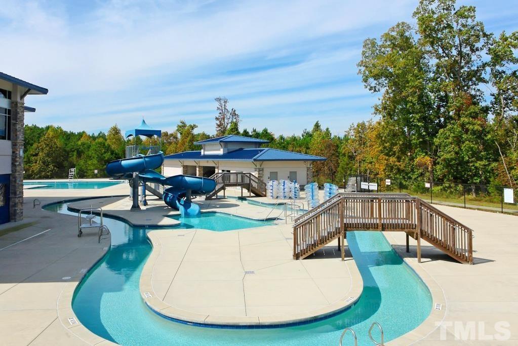 1004 Grand Ridge Drive Rolesville, NC 27571 - Photo 22 of 24 a view of a swimming pool with outdoor seating