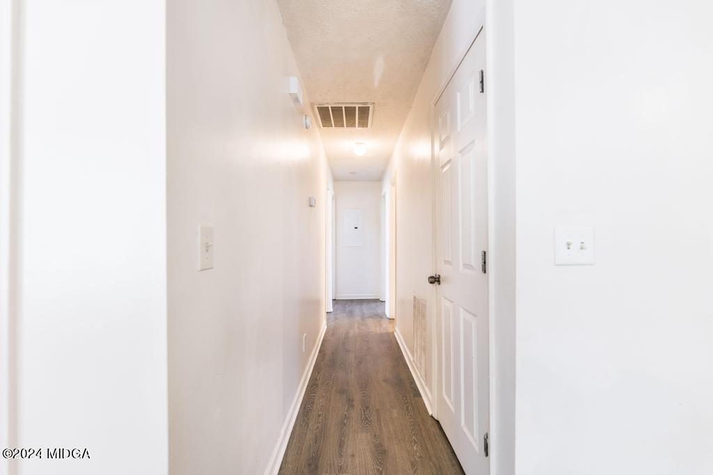 118 Toomer Road Perry, GA 31069 - Photo 18 of 30 a view of a hallway with wooden floor