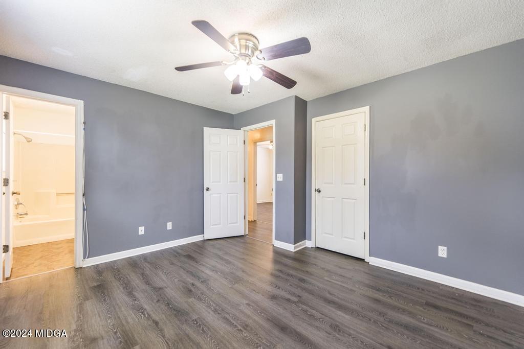 118 Toomer Road Perry, GA 31069 - Photo 20 of 30 an empty room with wooden floor and windows