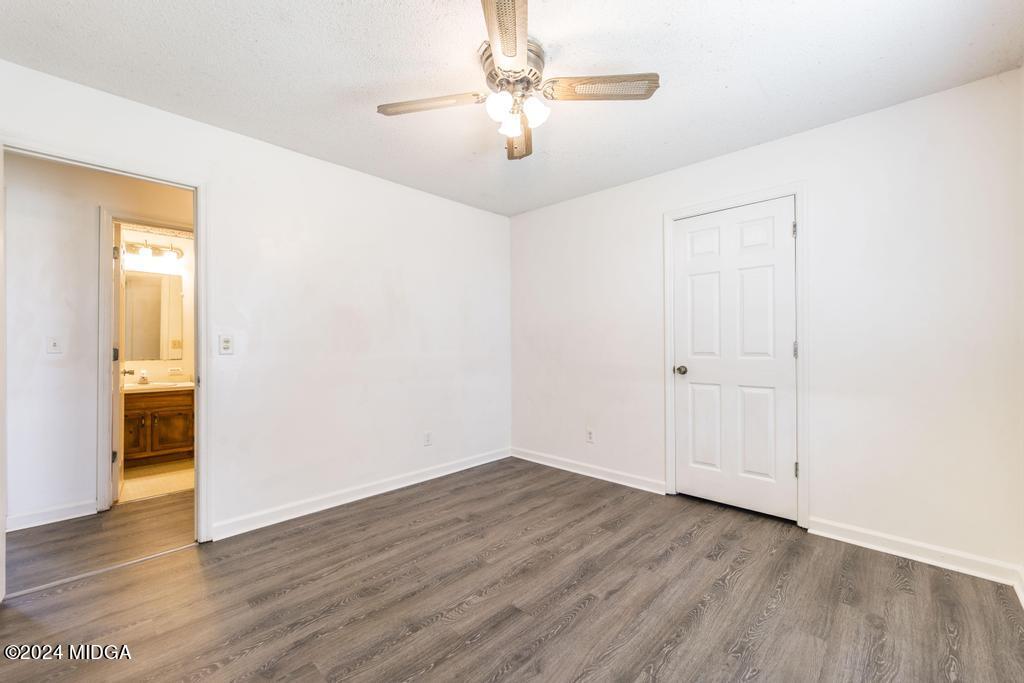 118 Toomer Road Perry, GA 31069 - Photo 26 of 30 a view of a room with wooden floor and a ceiling fan