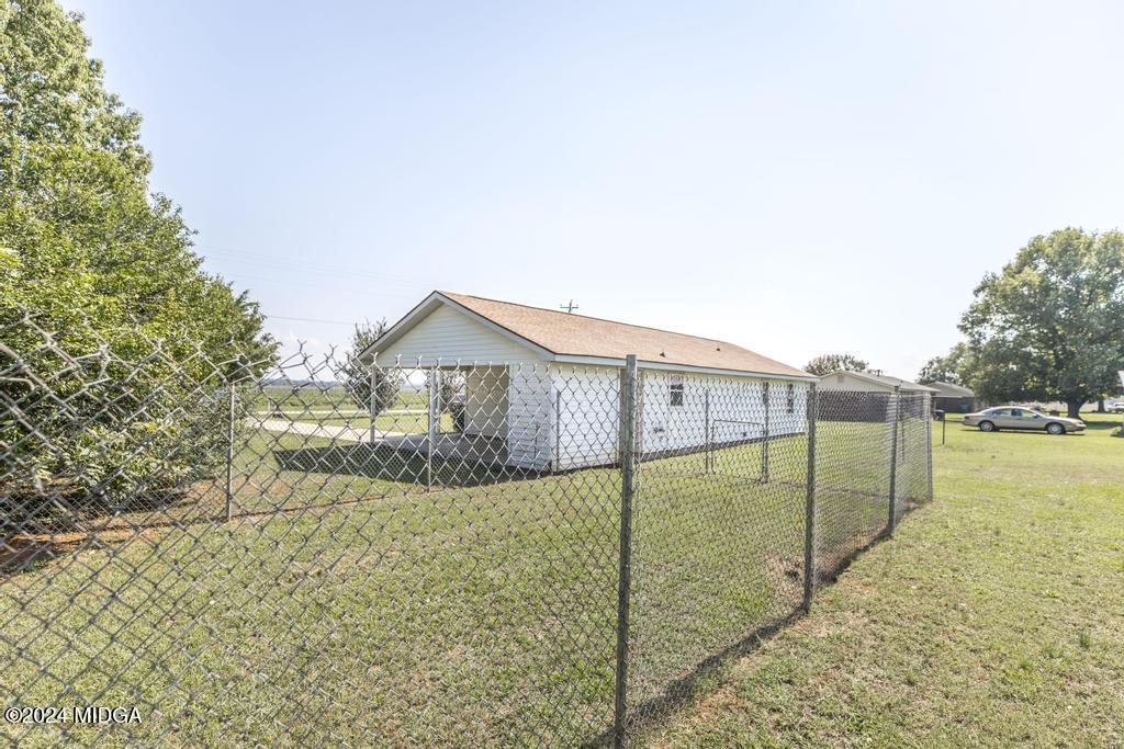 118 Toomer Road Perry, GA 31069 - Photo 29 of 30 a view of a house with a backyard