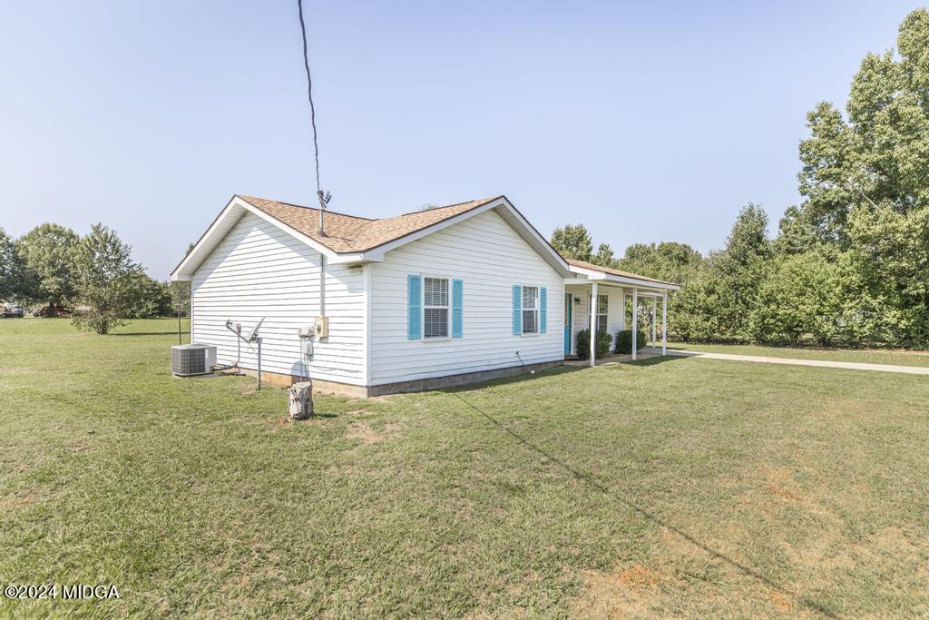 118 Toomer Road Perry, GA 31069 - Photo 3 of 30 a view of a house with a backyard