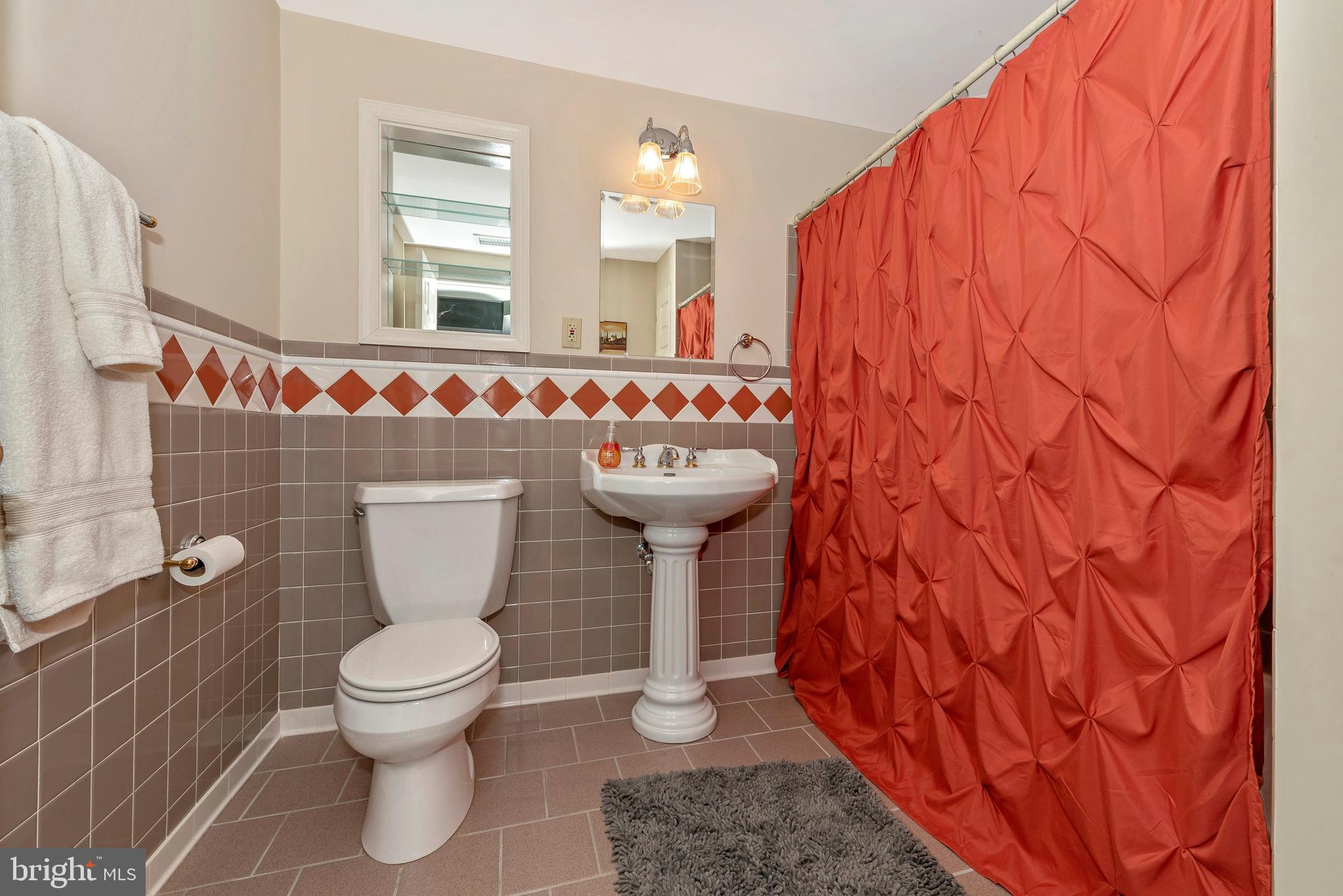 3232 Sigler Road Jefferson, MD 21755 - Photo 35 of 35 a bathroom with a toilet sink and mirror
