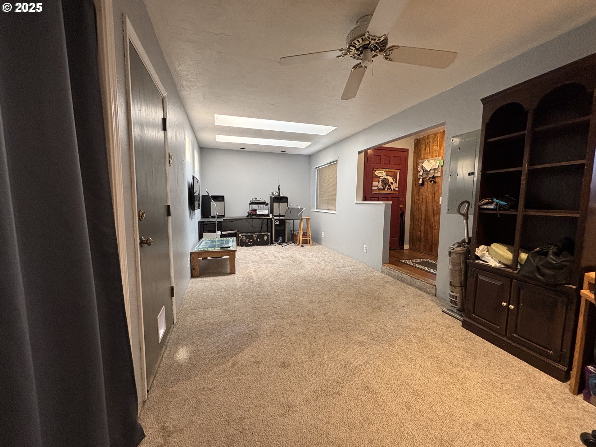 7066 Aster Street Springfield, OR 97478 - Photo 11 of 46 a view of a livingroom with furniture and a ceiling fan