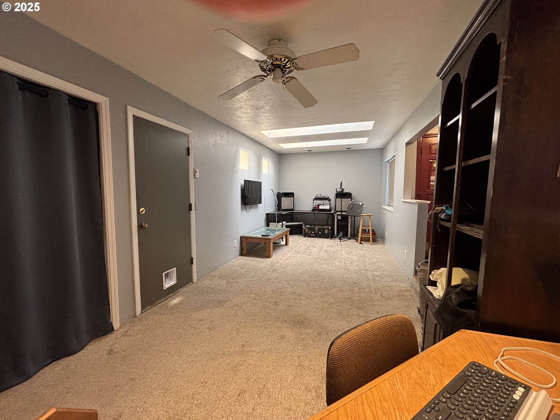 7066 Aster Street Springfield, OR 97478 - Photo 12 of 46 a bedroom with furniture and a ceiling fan
