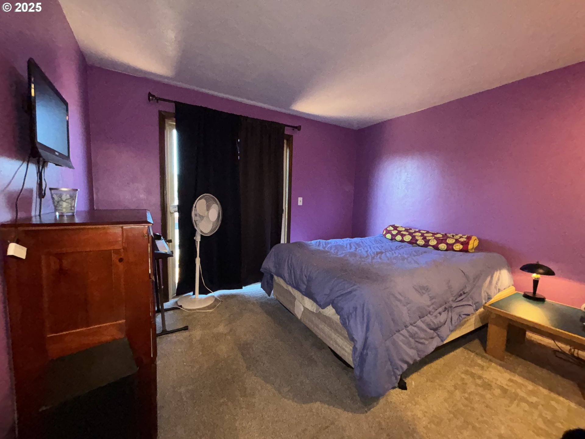 7066 Aster Street Springfield, OR 97478 - Photo 23 of 46 a bed sitting in a room next to a window