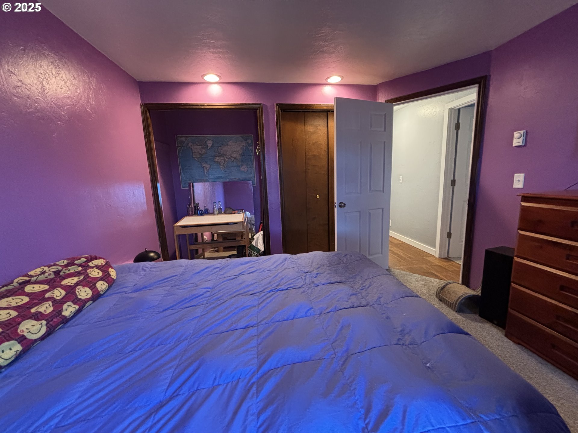 7066 Aster Street Springfield, OR 97478 - Photo 24 of 46 a bedroom with a bed and a mirror
