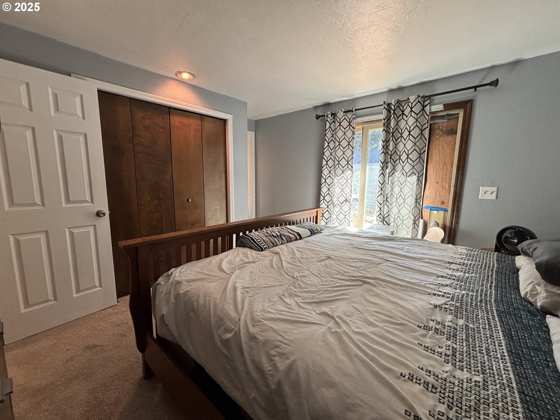 7066 Aster Street Springfield, OR 97478 - Photo 26 of 46 a bedroom with a bed and a window