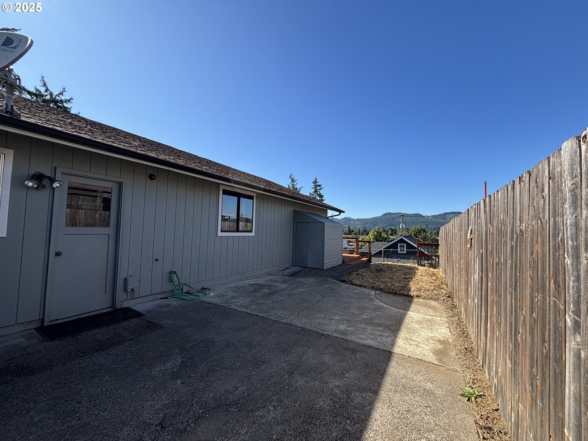 7066 Aster Street Springfield, OR 97478 - Photo 31 of 46 a view of a house with a backyard