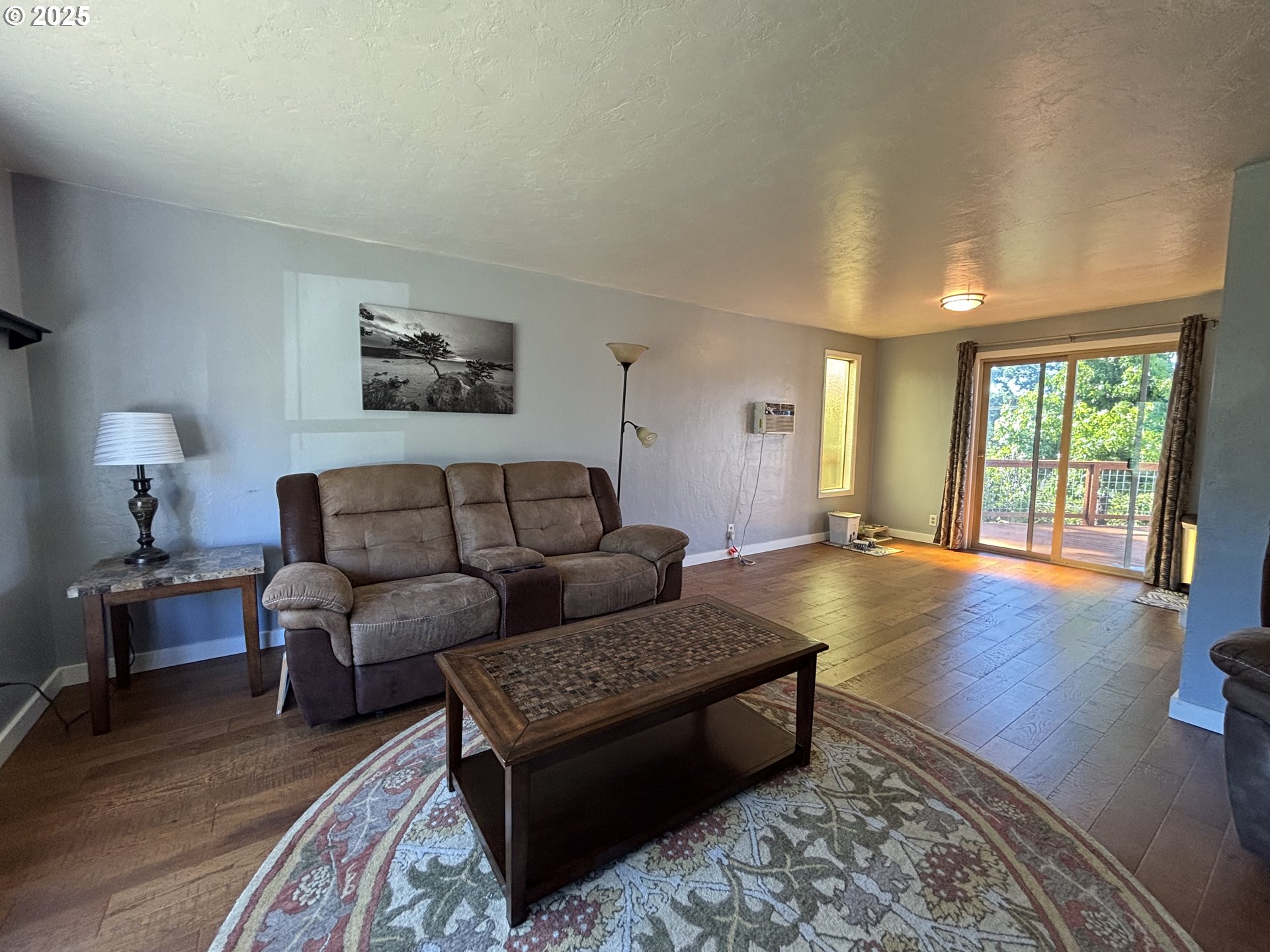 7066 Aster Street Springfield, OR 97478 - Photo 4 of 46 a living room with furniture and a wooden floor