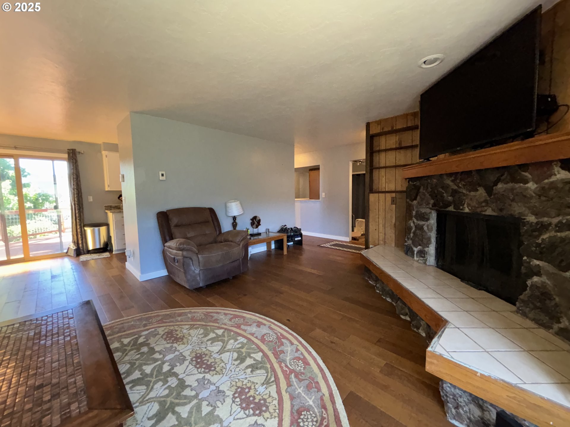 7066 Aster Street Springfield, OR 97478 - Photo 5 of 46 a living room with furniture and a fireplace
